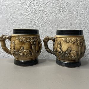 2 VTG Beer or Coffee Stone Wear Mugs 4" Tall Rabbits Deer Black Trim Germany‎